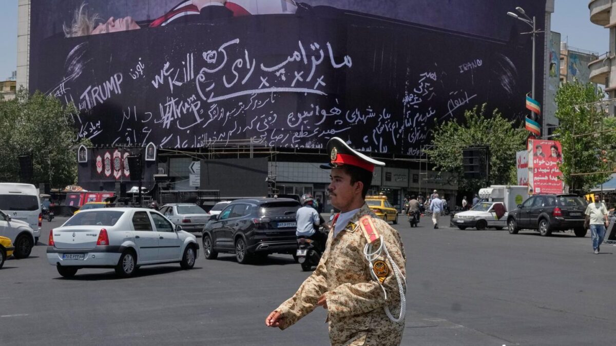 A billboard depicting U.S. President Donald Trump lying on what appears to be a coffin appears in downtwon Tehran, reflective of tensions between the two countries over reopening the Strait of Hormuz
