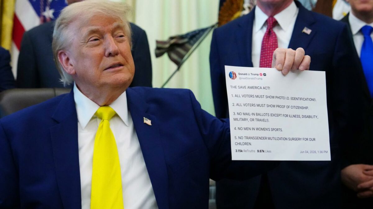 President Donald Trump holds up an image taken from his Truth Social account at an event about coal, Thursday, June 4, 2026, in the Oval Office of the White House.