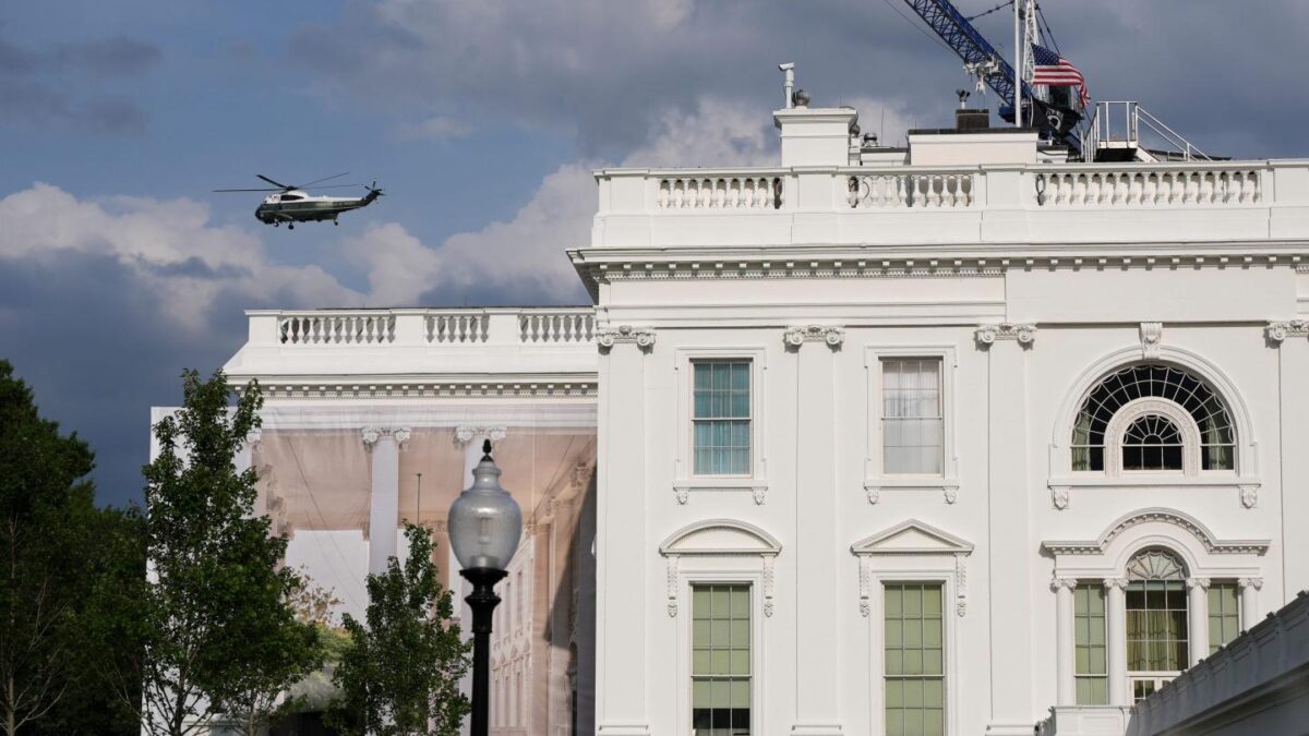 A helicopter from Marine Helicopter Squadron One, or HMX-1, flies past the White House after President Donald Trump arrived at the Ellipse near the White House, Friday, Aug. 28, 2026, in Washington, on return from Houston.
