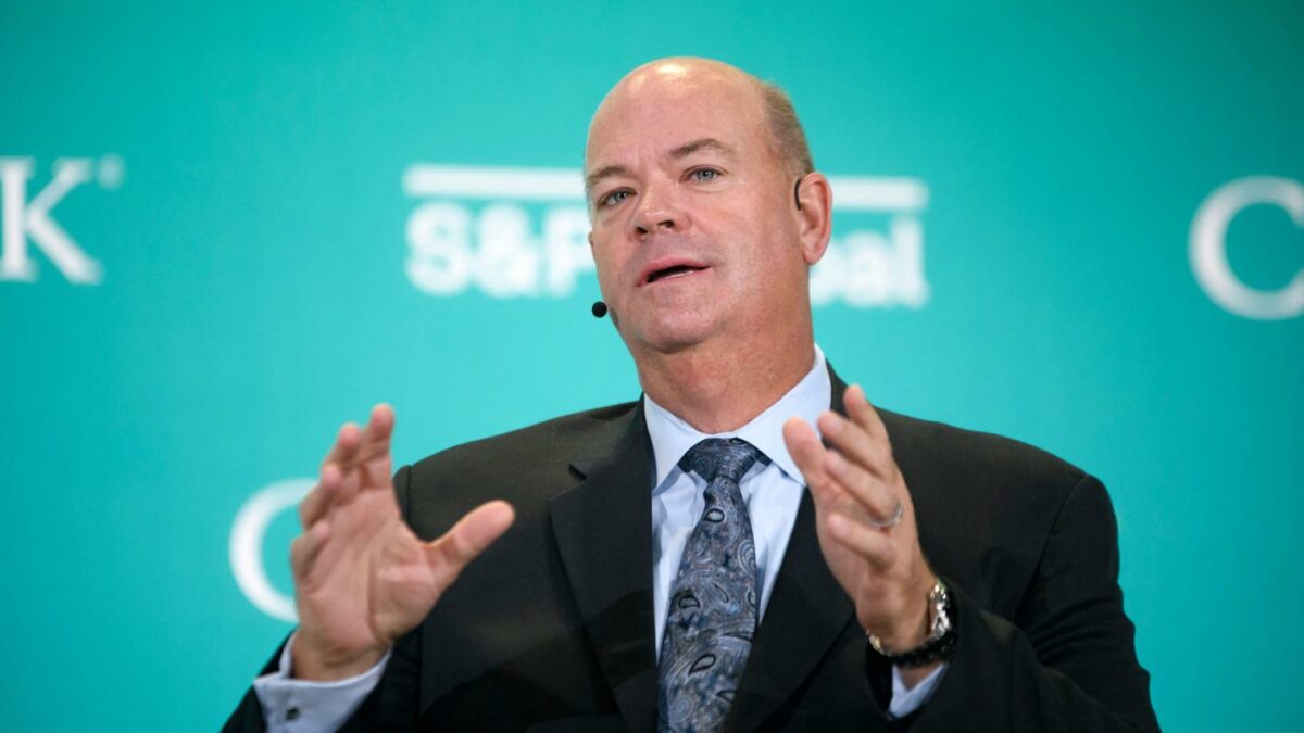 ConocoPhillips CEO Ryan Lance speaks while seated on stage at an energy conference in Houston.