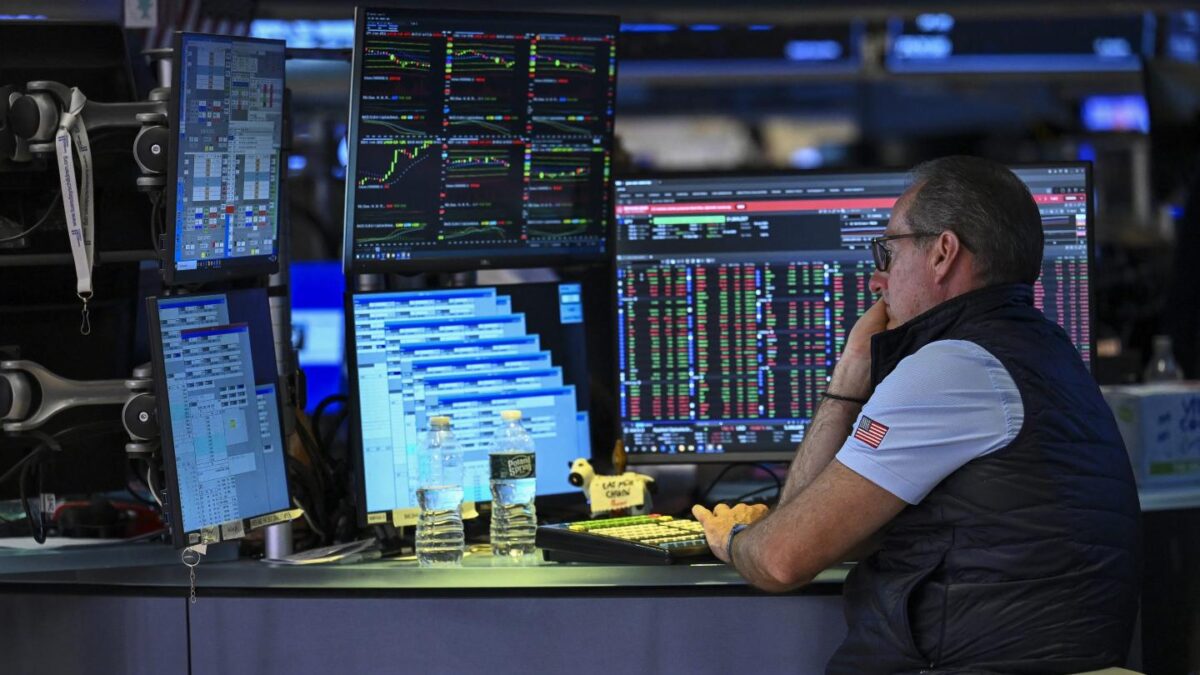 A trader works on the floor of the New York Stock Exchange (NYSE) on July 24, 2026 in New York. Oil prices surged past $100 a barrel on July 23 as Iran-backed Houthi rebels targeted Red Sea shipping as threats by US President Donald Trump to strike them in return sent equity markets slumping.