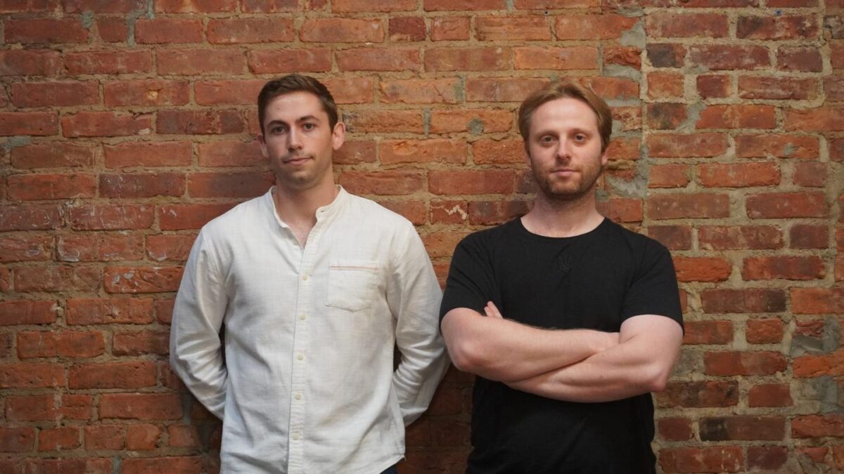 Pascal cofounders Matthew Downey (left) and Ivo Crnkovic-Rubsamen (right) stand side by side against a brick wall.